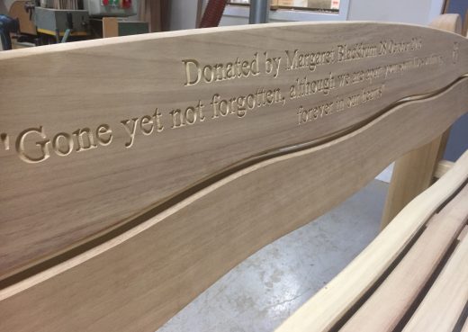 Waveform bench with engraved inscription