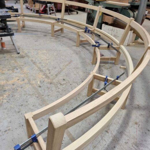 The Scarborough Crescent wooden bench frame clamped and glueing